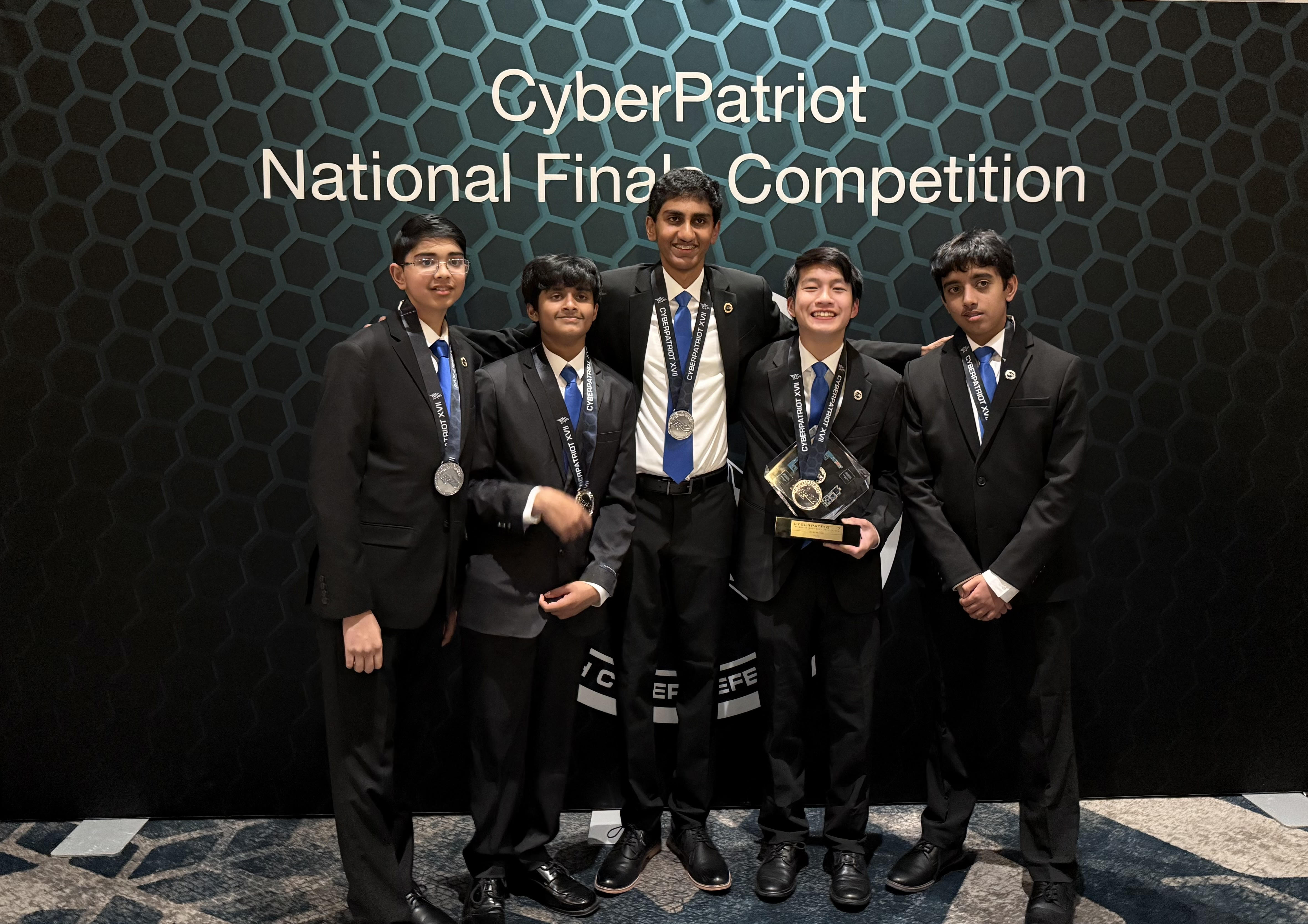 CyberPatriot team holding trophy at National Finals